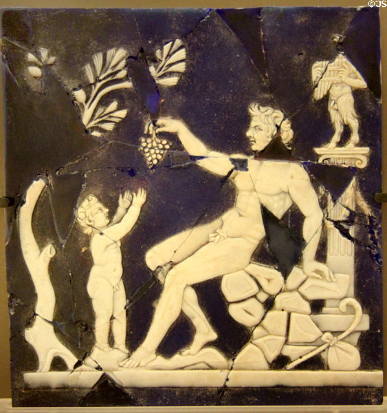Cameo glass of Satyr handing grapes to infant Bacchus (early 1stC CE) from Italy at Petit Palace Museum. Paris, France.