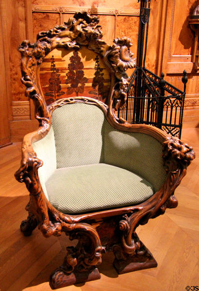 Sculpted wooden armchair which belonged to Sarah Bernhardt (1900-6) at Musée d'Orsay. Paris, France.