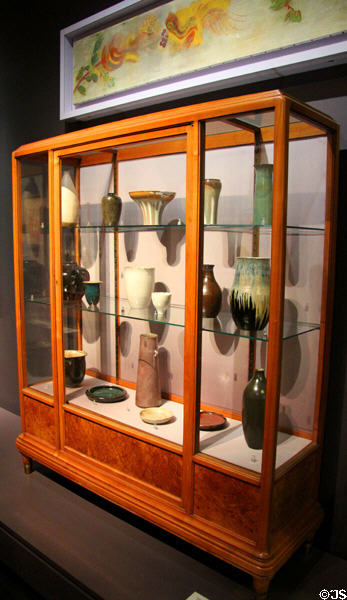 Collection of ceramic vessels (1894-1918) mostly by Auguste Delaherche in vitrine (1911) by Léon Jallot at Musée d'Orsay. Paris, France.
