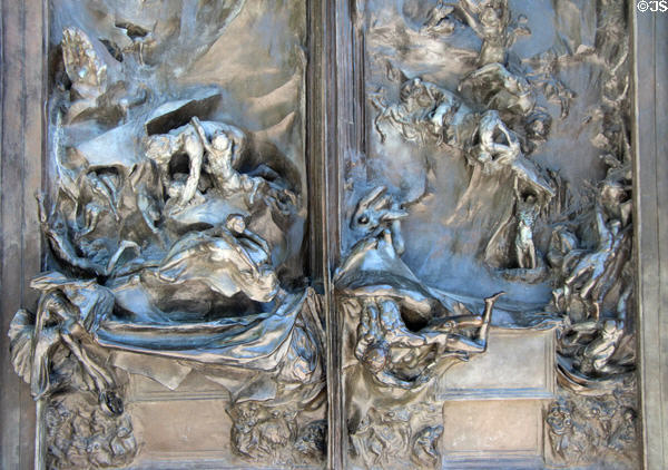 Lower details of Gates of Hell doors with writhing souls without hope by Auguste Rodin at Rodin Museum. Paris, France.