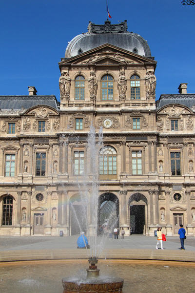 Lescot wing of Louvre Palace with pyramid seen through arch. Paris, France.