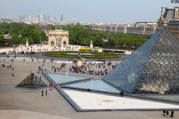 Highrises of La Defense, Arc de Triomphe du carrousel & Pyramid of Louvre Palace. Paris, France.