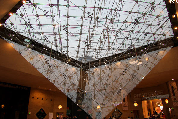 Inverted pyramid projecting into shopping mall at Louvre Museum. Paris, France.