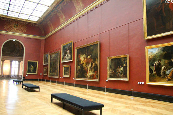 Grand gallery of historic paintings at Louvre Museum. Paris, France.