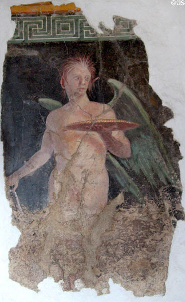 Roman fresco of winged genius holding platter buried at Boscoreale by eruption of Mount Vesuvius (79 CE) at Louvre Museum. Paris, France.