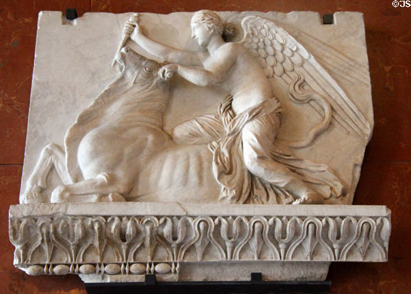 Marble relief of Victory sacrificing a bull (100-125 CE) from Rome at Louvre Museum. Paris, France.