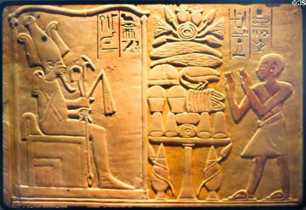Priest Pentcheny worships Osiris Egyptian stella (c1450 BCE - 18th Dynasty) at Louvre Museum. Paris, France.