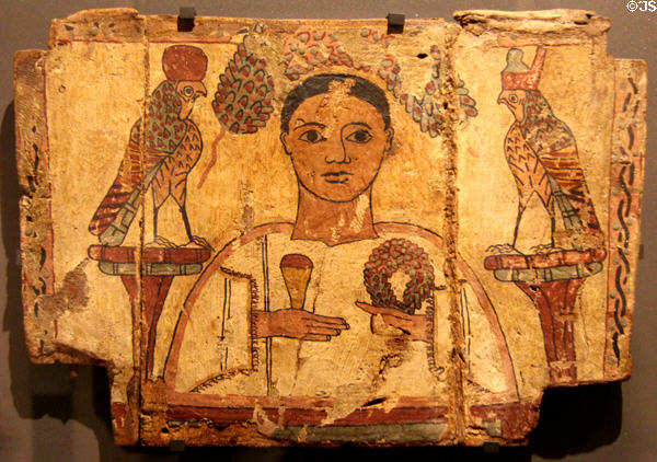 Painted coffin panel of young man with club & garland flanked by crowned falcons (4thC CE) from Hermopolis in Egypt at Louvre Museum. Paris, France.