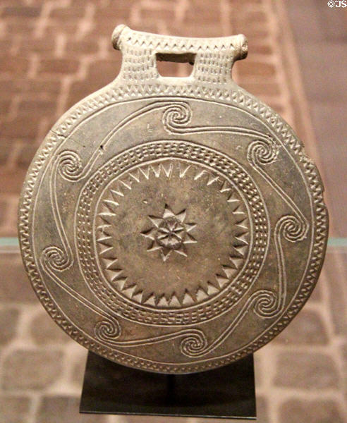 Cycladian terracotta object of unknown use called "frying pans" (c2700 BCE) decorated with spirals at Louvre Museum. Paris, France.