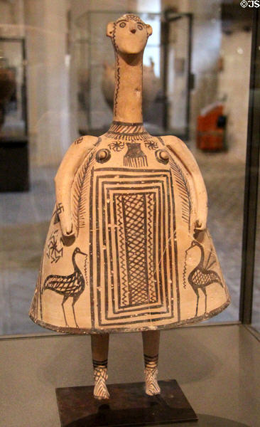 Theban terracotta bell-shaped female idol (c700 BCE) painted in geometric style with aquatic birds found in child's tomb at Louvre Museum. Paris, France.