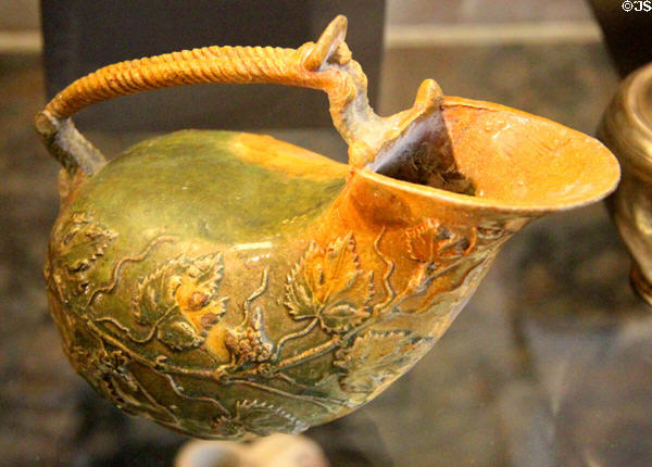 Glazed ceramic twisted handle askos pouring vessel (1stC BCE) from Italy at Louvre Museum. Paris, France.
