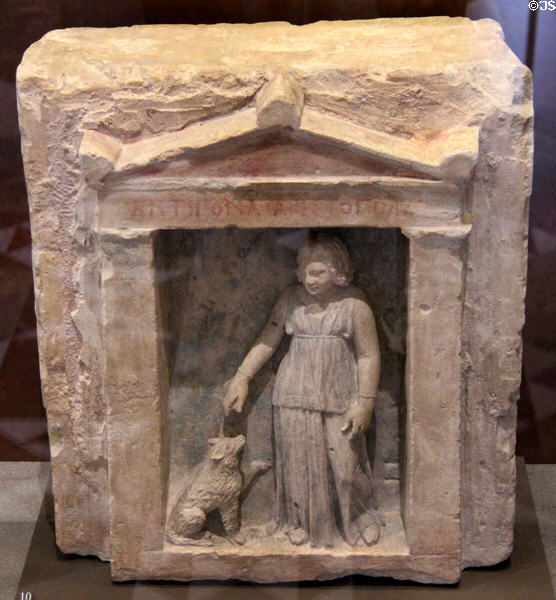 Funerary stela of Antigona & Aristopolis in naïskos form with little girl & dog (300-250 BCE) from Alexandria in Hellenistic Egypt at Louvre Museum. Paris, France.