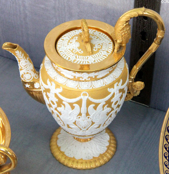 Sèvres porcelain gilded coffee pot with bisque areas (1813) by Jean-Marie-Ferdinand Régnier given by Napoleon I to Duchess of Castiglione at Sèvres National Ceramic Museum. Paris, France.
