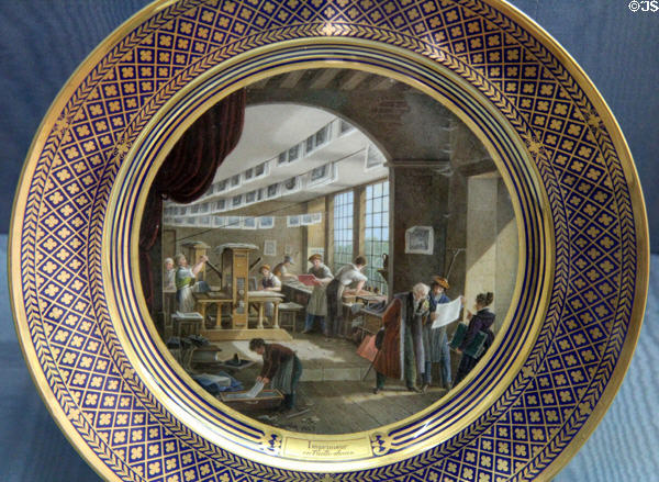 Sèvres porcelain plates showing industrial art of printing (1820-35) by Jean-Charles Develly at Sèvres National Ceramic Museum. Paris, France.