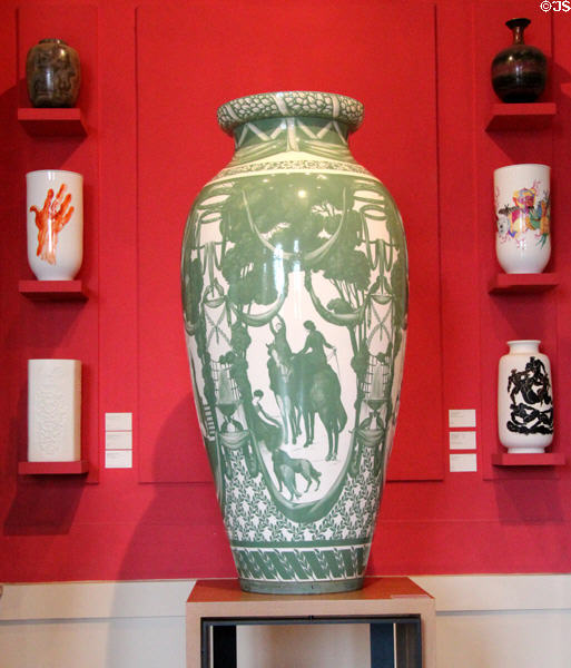 Sèvres porcelain vase with scene of people, horses & dogs at Sèvres National Ceramic Museum. Paris, France.
