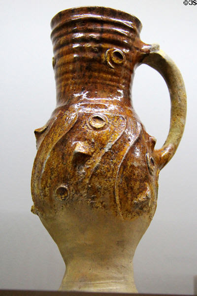 Glazed earthenware pitcher with ridges (1340-60) from Paris? at Sèvres National Ceramic Museum. Paris, France.