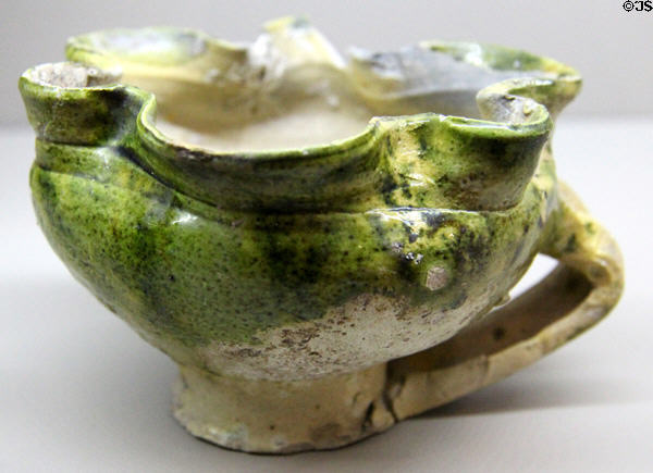 Glazed earthenware cup (14thC) from Paris at Sèvres National Ceramic Museum. Paris, France.