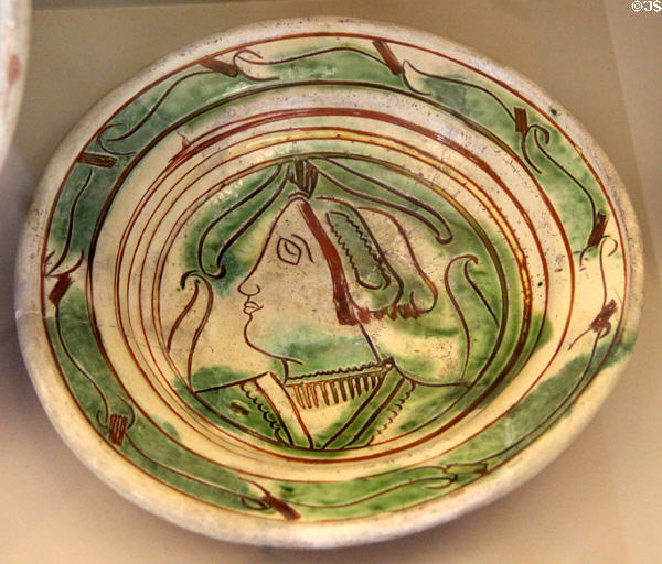 Glazed earthenware bowl with line-drawn facial profile of woman (1500-1550) from Beauvaisis at Sèvres National Ceramic Museum. Paris, France.