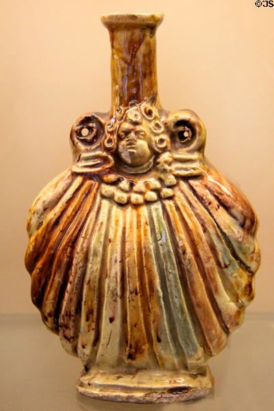 Glazed earthenware pilgrim's gourd (1600-20) from Saintonge, France at Sèvres National Ceramic Museum. Paris, France.