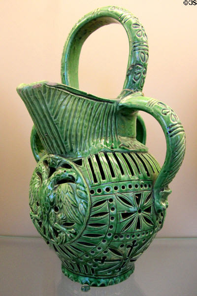 Glazed earthenware jug with 3 handles incised with two-headed eagle (1600-50) from Saintonge, France at Sèvres National Ceramic Museum. Paris, France.