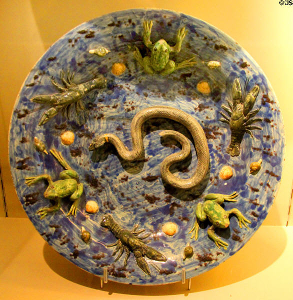Ceramic plate with moulded snake, crayfish & frogs (1599) by Agostine Conrado from Nevers, France at Sèvres National Ceramic Museum. Paris, France.