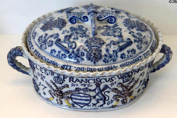 Ceramic covered tureen painted with Latin phrases (1717) by Jacobus Hennekens from Bailleul, France at Sèvres National Ceramic Museum. Paris, France.