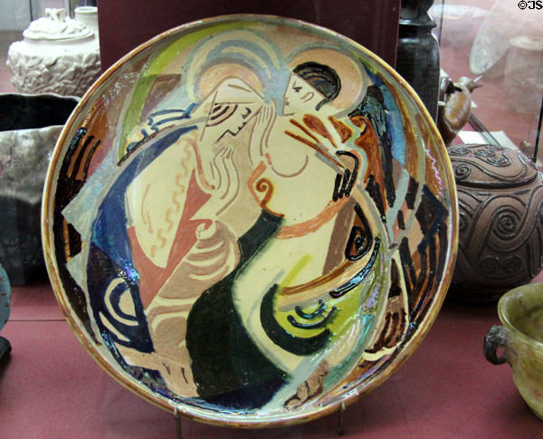 Glazed earthenware plate painted with blessing scene (1939) by Anne Dangar from Moly Sabata (Isère) at Sèvres National Ceramic Museum. Paris, France.