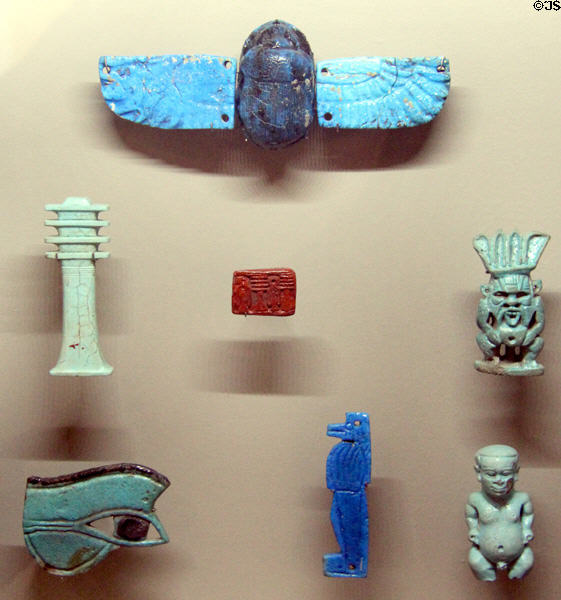Egyptian glass amulets (1550-525 BCE) at Sèvres National Ceramic Museum. Paris, France.