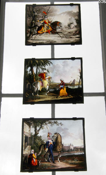 Painted scenes on glass of 19thC scenes of French soldiers with horses at Sèvres National Ceramic Museum. Paris, France.