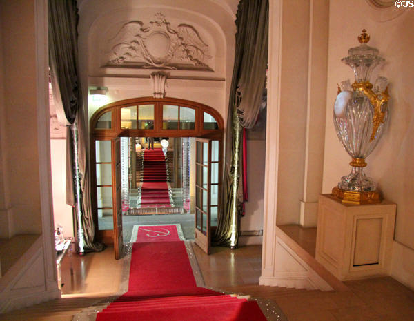 Stairway rising to Baccarat Museum with large Baccarat crystal vase. Paris, France.
