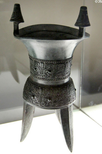 Chinese Shang Dynasty Jia bronze tripod vase for fermented drinks (1550-1050 BCE) at Cernuschi Museum. Paris, France.
