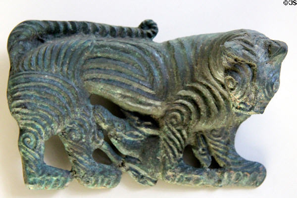 Mongolian bronze plaque for belt showing tiger overpowering an ibex (6th-5thC BCE) at Cernuschi Museum. Paris, France.