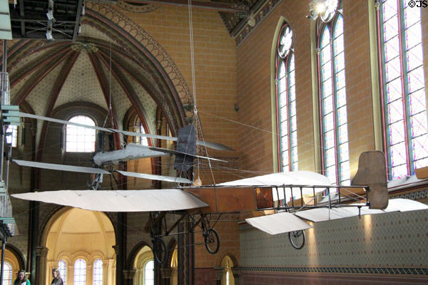 Blériot XI French monoplane used by Louis Blériot for first flight across English Channel (July, 25 1909) with biplane Breguet (1911) beyond at Arts et Metiers Museum. Paris, France.