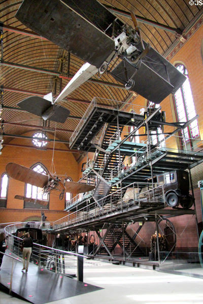Breguet biplane (1911) over racks of French technology at Arts et Metiers Museum. Paris, France.