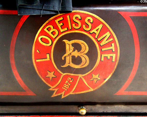 Detail of brand mark of L'Obéissante (Obedient) steam-powered omnibus (1873) by Amédée Bollée at Arts et Metiers Museum. Paris, France.