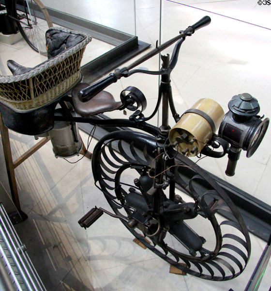 Petrol-powered tricycle with motor within drive wheel (1887) by Félix Millet at Arts et Metiers Museum. Paris, France.