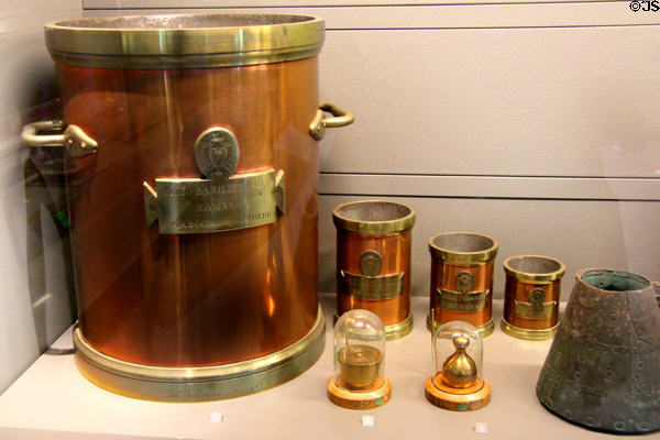 Standard measures for oil (1842) from Rome plus standard weights from England at Arts et Metiers Museum. Paris, France.