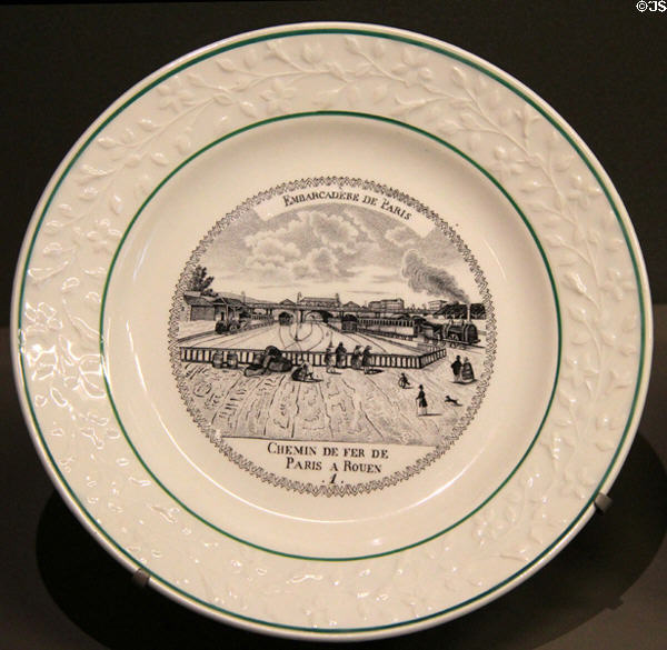 Printed porcelain plate with first French rail line Paris to Rouen (mid 19thC) by Manuf. Boulenger et Hautin of Choisy -le-Roy at Arts et Metiers Museum. Paris, France.