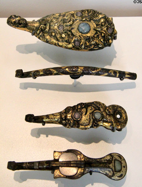 Silvered bronze clothing hooks (4thC BCE) from northern China at Guimet Museum. Paris, France.