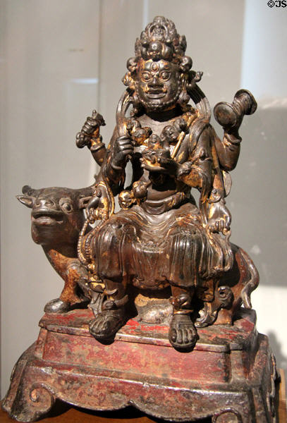 Chinese gilded iron statuette of doctrine guardian (16thC CE) from Sichuan or Yunnan at Guimet Museum. Paris, France.