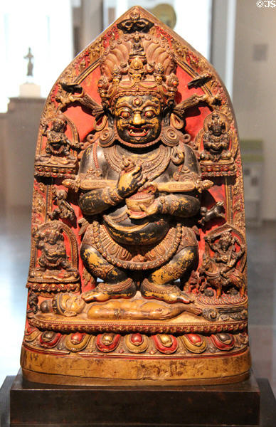 Polychromed stone statue of doctrine guardian (1292) from Tibet at Guimet Museum. Paris, France.