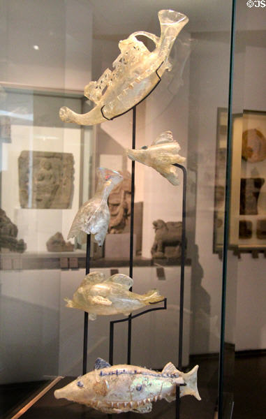 Blown glass flasks in shape of galley ship & fish (1stC) from Afghanistan at Guimet Museum. Paris, France.