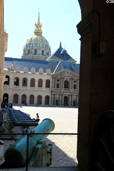 Historic canons with courtyard & dome at Les Invalides. Paris, France.