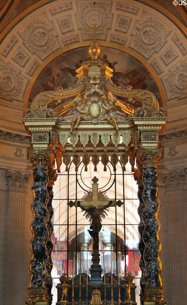 Baroque baldachin in former royal Dome with window dividing former Royal Chapel from veterans' chapel beyond at Les Invalides. Paris, France.