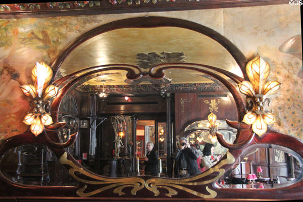 Maxim's Restaurant Art Nouveau mirror & lily lamps. Paris, France.