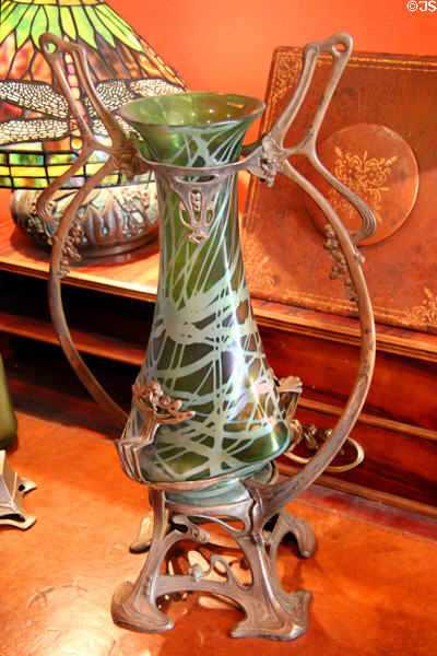 Glass vase in metal frame at Maxim's Art Nouveau Collection 1900. Paris, France.