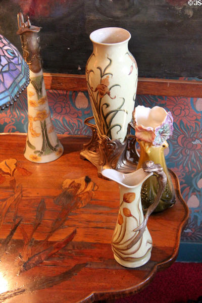 Ceramic floral vases & pitchers at Maxim's Art Nouveau Collection 1900. Paris, France.