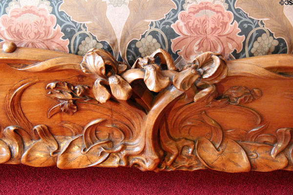 Detail of carved bedstead footboard at Maxim's Art Nouveau Collection 1900. Paris, France.