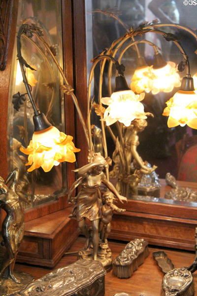 Table lamp in form of flowers on stems at Maxim's Art Nouveau Collection 1900. Paris, France.