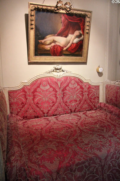 Alcove bed (1765-75) under portrait of Mlle Duthé by Henri-Pierre Danloux in bedroom at Nissim de Camondo Museum. Paris, France.